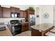 Spacious kitchen with granite countertops, stainless steel appliances, and lots of storage at 8359 E Ingram Cir, Mesa, AZ 85207