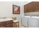 Laundry room featuring a white washer and dryer next to a utility sink at 8359 E Ingram Cir, Mesa, AZ 85207