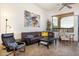 Comfortable living room with tile floors, ample seating, and natural light at 8359 E Ingram Cir, Mesa, AZ 85207