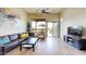 Comfortable living room with a plush sofa, stylish decor, and large windows at 8359 E Ingram Cir, Mesa, AZ 85207