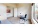 Bright office features a desk, chair, neutral walls, carpet floors, and large sunny window at 8359 E Ingram Cir, Mesa, AZ 85207