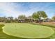 Manicured putting green with multiple holes in an outdoor setting at 8359 E Ingram Cir, Mesa, AZ 85207