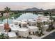 Beautiful waterfront home featuring desert landscaping and a view of Camelback mountain at 8369 E Del Camino Dr, Scottsdale, AZ 85258