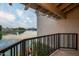 Balcony view overlooking a serene lake and residential community at 8369 E Del Camino Dr, Scottsdale, AZ 85258
