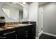 Bathroom featuring modern vanity with granite countertop and glass-enclosed shower at 8369 E Del Camino Dr, Scottsdale, AZ 85258