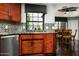 This elegant kitchen has stainless appliances, a granite countertop, and sleek cabinets at 8369 E Del Camino Dr, Scottsdale, AZ 85258