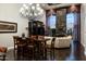 Elegant living area with a fireplace, media center, and large windows, providing natural light at 8369 E Del Camino Dr, Scottsdale, AZ 85258