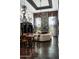 Spacious living room featuring a slate fireplace, high ceilings, and an elegant chandelier at 8369 E Del Camino Dr, Scottsdale, AZ 85258