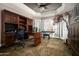 Home office with custom built-ins, a desk, and a view of the backyard at 8369 E Del Camino Dr, Scottsdale, AZ 85258