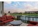 Scenic patio with comfortable seating overlooking the serene lake at 8369 E Del Camino Dr, Scottsdale, AZ 85258