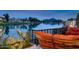 Relaxing lakeside patio with comfortable seating and scenic mountain views at 8369 E Del Camino Dr, Scottsdale, AZ 85258