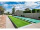 Well-maintained shuffleboard court in a community, perfect for outdoor recreation and friendly competition at 8369 E Del Camino Dr, Scottsdale, AZ 85258