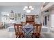 Well-appointed dining room with a charming chandelier and ample seating, perfect for hosting dinner parties at 8568 W Purdue Ave, Peoria, AZ 85345