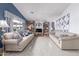Spacious living room features natural lighting and an entertainment center, ideal for relaxation and gatherings at 8568 W Purdue Ave, Peoria, AZ 85345