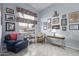 Cozy living room featuring a large window, comfortable seating and decor at 8568 W Purdue Ave, Peoria, AZ 85345