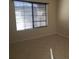 A well-lit bedroom featuring tile flooring and a window with blinds at 9253 N Firebrick Dr # 143, Fountain Hills, AZ 85268