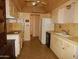 Functional kitchen featuring ample cabinet space and a refrigerator at 10319 W Willie Low Cir, Sun City, AZ 85351