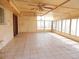 Large sun room with tile flooring and an abundance of natural light at 10319 W Willie Low Cir, Sun City, AZ 85351