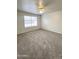 Bedroom with new carpet, ceiling fan and natural light at 1404 S Doran --, Mesa, AZ 85204