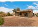 View of the backyard featuring a covered patio and desert landscaping at 15026 W Cactus Ridge Way, Surprise, AZ 85374