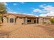 Backyard featuring a covered patio, low-maintenance landscaping and privacy at 15026 W Cactus Ridge Way, Surprise, AZ 85374