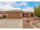 Exterior of a single story house with desert landscaping at 15026 W Cactus Ridge Way, Surprise, AZ 85374