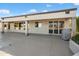 Covered back patio with a grill and access to the backyard, perfect for outdoor entertaining at 15560 W Clear Canyon Dr, Surprise, AZ 85374