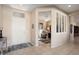 Inviting entryway with tile flooring, neutral walls, and a glimpse into the living spaces at 15560 W Clear Canyon Dr, Surprise, AZ 85374