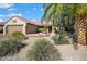 Charming single-story home featuring a desert landscape and private two-car garage at 15560 W Clear Canyon Dr, Surprise, AZ 85374