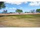 Scenic view of the lush green golf course with mature trees, perfect for golf enthusiasts at 15560 W Clear Canyon Dr, Surprise, AZ 85374
