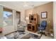 Open living room with comfortable seating, carpet floors, natural light, and tile flooring at 15560 W Clear Canyon Dr, Surprise, AZ 85374