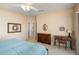 Serene main bedroom featuring a ceiling fan, carpet, and ample natural light at 15560 W Clear Canyon Dr, Surprise, AZ 85374