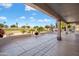 Large covered patio overlooking the golf course, perfect for outdoor entertaining at 15560 W Clear Canyon Dr, Surprise, AZ 85374