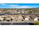 Aerial view of a street with homes and desert landscaping at 1563 S 227Th Ave, Buckeye, AZ 85326