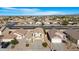 Aerial view of neighborhood with houses with brown roofs at 1563 S 227Th Ave, Buckeye, AZ 85326