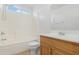 Bathroom featuring a shower-tub combo, neutral tile floors, and a single sink vanity with a large mirror at 1563 S 227Th Ave, Buckeye, AZ 85326
