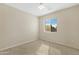 A carpeted bedroom with a window providing natural light, creating a calm and inviting atmosphere at 1563 S 227Th Ave, Buckeye, AZ 85326