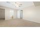 Spacious carpeted bedroom with access to an ensuite bathroom at 1563 S 227Th Ave, Buckeye, AZ 85326