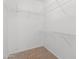 Walk-in closet with carpeted floor and white wire shelving on all walls providing ample storage space at 1563 S 227Th Ave, Buckeye, AZ 85326