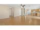 Open floor plan with laminate flooring connects kitchen and living area at 1563 S 227Th Ave, Buckeye, AZ 85326