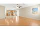 Open floor plan with laminate flooring connects kitchen and living area at 1563 S 227Th Ave, Buckeye, AZ 85326