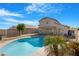 Backyard pool with blue water and tropical landscaping at 1563 S 227Th Ave, Buckeye, AZ 85326