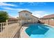 View of backyard pool with partial fence and shade at 1563 S 227Th Ave, Buckeye, AZ 85326