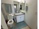 Clean bathroom with a vanity, toilet, and a mirror with plenty of light at 1701 E Colter St # 138, Phoenix, AZ 85016