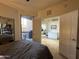 Cozy bedroom featuring neutral tones, a ceiling fan, and access to a private patio at 1701 E Colter St # 138, Phoenix, AZ 85016