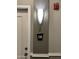 Hallway features a modern wall sconce and apartment number sign near a white door at 1701 E Colter St # 138, Phoenix, AZ 85016