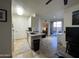 Bright, open kitchen with stainless steel appliances, a breakfast bar, and sliding glass doors at 1701 E Colter St # 138, Phoenix, AZ 85016