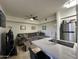 Stylish living area with stainless steel appliances, kitchen bar and inviting seating area at 1701 E Colter St # 138, Phoenix, AZ 85016