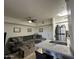 Inviting living room with tile floors, ceiling fan, and views into the kitchen area at 1701 E Colter St # 138, Phoenix, AZ 85016