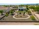 Expansive backyard featuring desert landscaping, winding stone pathways, and a covered patio, perfect for outdoor living at 1775 N 164Th Dr, Goodyear, AZ 85395